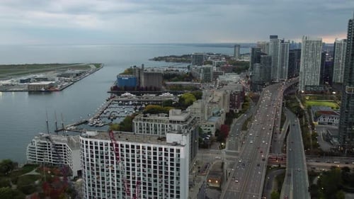 Aerial view overlooking the Bathurst Quay and traffic on the Gardiner Expy, in Cloudy Toronto, Canad