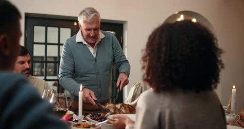 Thanksgiving, serving and cut turkey with family for feast, party and happy at dining table in home