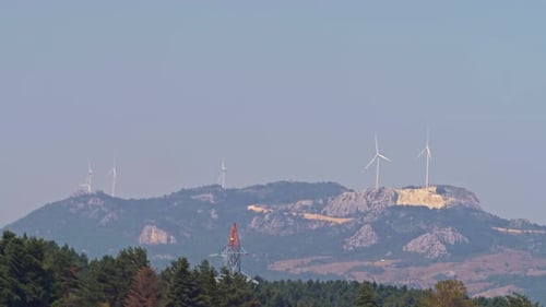 Wind Turbines on Mountain Range in Daytime