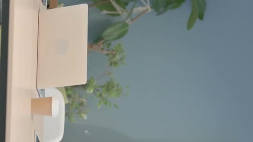 Senior Man Works on Laptop at Desk