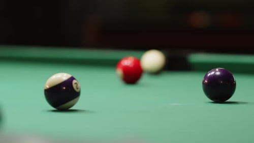 Colorful Billiard Balls in Different Parts of Baize Table