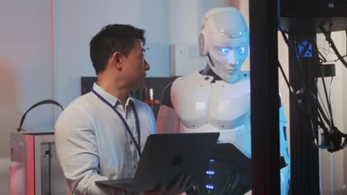 Scientist Reviews Data and Discusses Improvements for Humanoid Robot Operation in Laboratory Setting