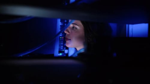 Woman Speaks Before Flashing Data Servers in Dark Room