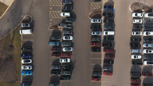 Aerial Top Down View of Car Moving and Standing on Parking Lot