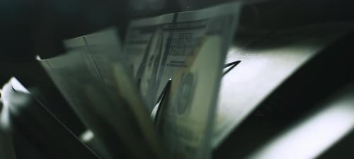 Close Up of Money Counting Machine Processing Currency