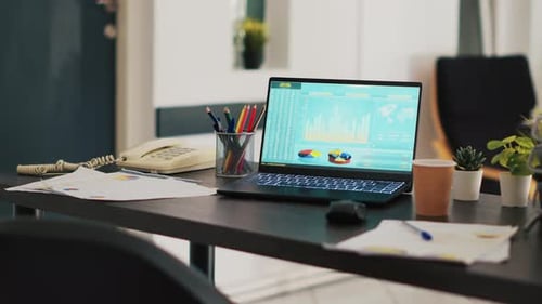 Financial Stock Market Diagrams with Charts and Stock Numbers on Laptop Showing Profits