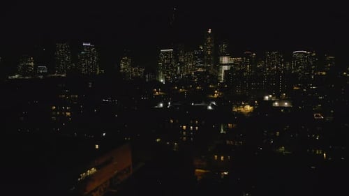 Aerial Panoramic Footage of Buildings in Night City