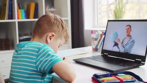 Boy Engaged in Online Learning at Home