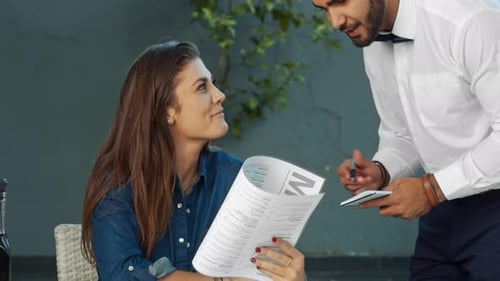 Young Independent Woman Giving Meal Order to Waiter in Cafe