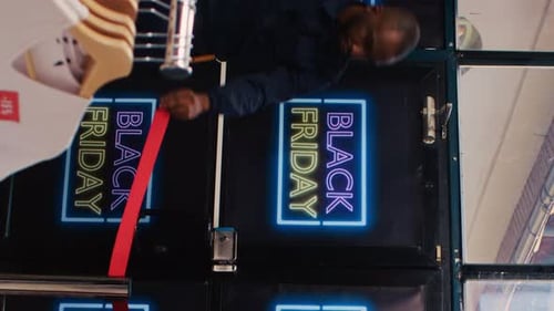 Shoppers Visit Store During Black Friday Sales Event