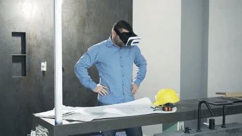Construction Worker Wearing VR Goggles at Worksite