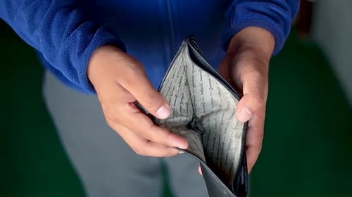 Bankruptcy and poverty concept. Unemployment during financial crisis, male opening black leather wal