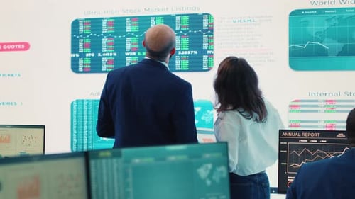 Team Analyzing Stock Market Data in Office
