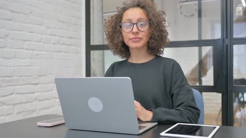 Young Adult Woman Working at Her Computer