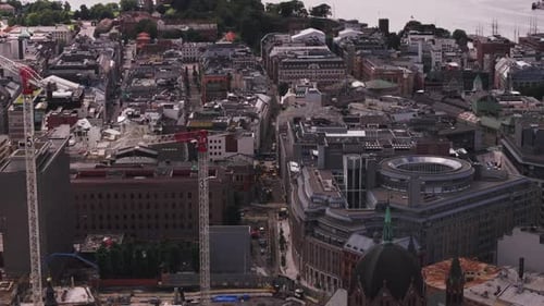 Aerial Footage of Modern Buildings in City Tower Cranes on Construction Site and Famous Akershus