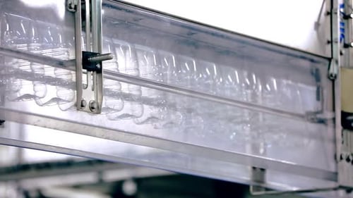Empty Plastic Bottle on Conveyor Line. Bottle Production Line. Plastic Bottles For
