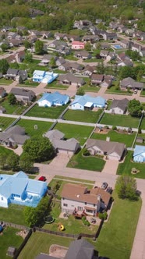 Suburban Neighborhood with House Colors Shifting to Mirror the Political Climate During US