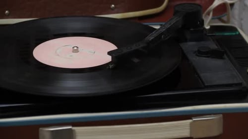 Vintage Vinyl Record Player. The Vinyl Record Is Spinning. The Camera Moves On A Slider. Close Up