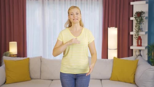 The woman making a video call.