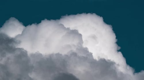 Thick fluffy clouds getting bigger, they are expanding into the atmosphere like a huge balloons chan