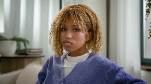 Blonde Woman Smiling Wearing Braces Indoors
