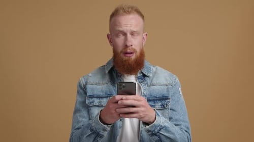 Closeup View of Caucasian Man Typing a Message on a Display