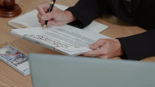 Woman Signing Contract with Money and Gavel