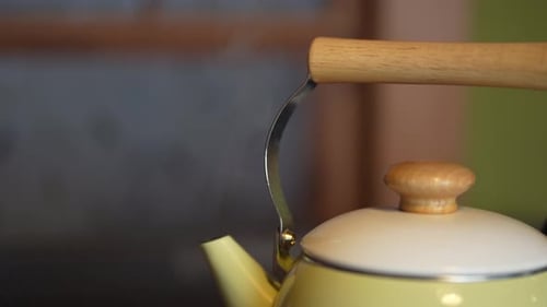 Yellow Tea Kettle Steaming Close Up