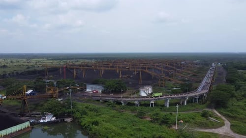 View of the coal terminal air with the activities of coal, barge and coal conveyor trucks
