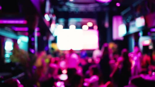 Blurred Crowd Partying in Club with Colorful Lights