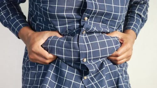 Man's Hand Holding Excessive Belly Fat Overweight Concept