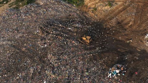 Top View of Bulldozer on a Landfill Site