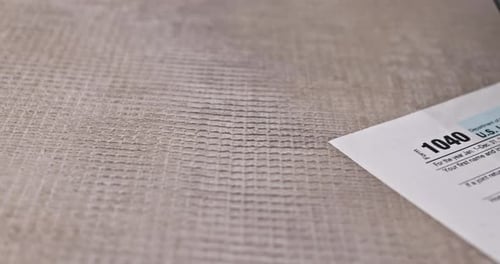 Tax Form, Calculator, and Check on Desk