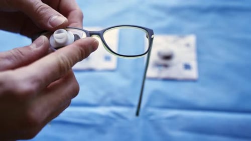 Installing Lenses in Glasses Frame on Blue