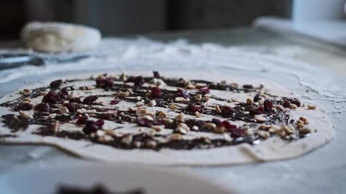 Preparing Dough with Chocolate Filling and Berries