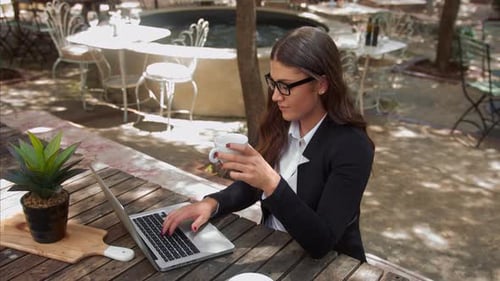Young Business Entrepreneur Woman Paying and Receiving Her Coffee Bill at Cafe