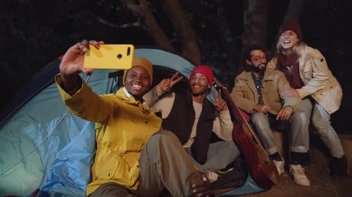 Friends Camping Taking Selfie at Night