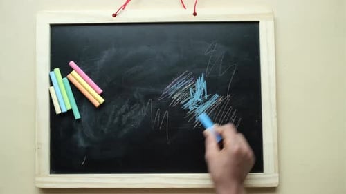 Colorful Chalk Scribbling on Blackboard at Home