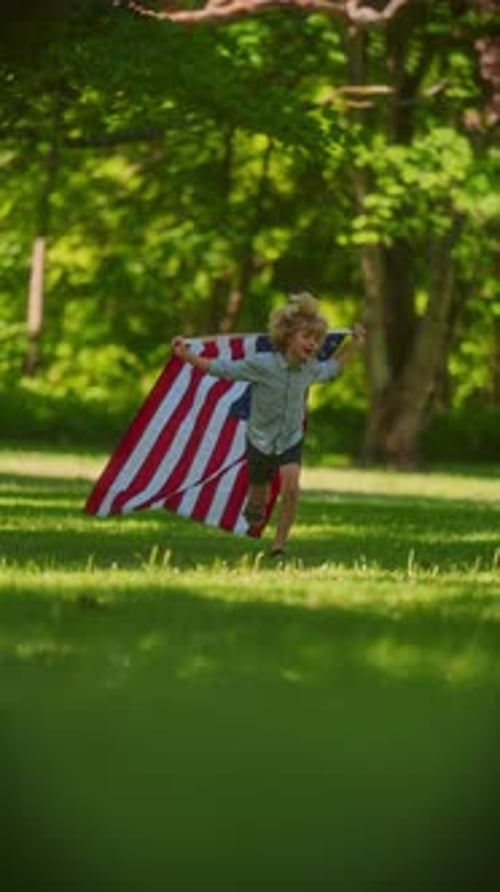 Excited Child Runs with American Flag Outdoors