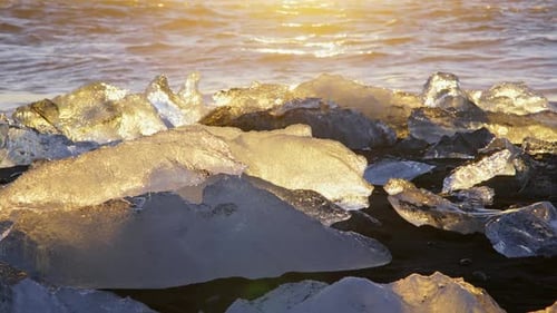 Icebergs At Sunset On Black Volcanic Beach In Iceland Nature