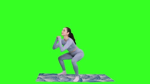 Smiling Sporty Woman Doing Squats Workout and Standing on Mat on the Chroma Key