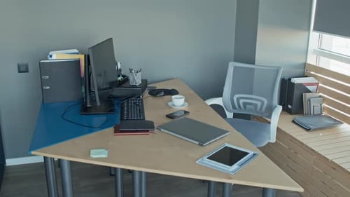 Empty Directors Office with Work Stuff on Table