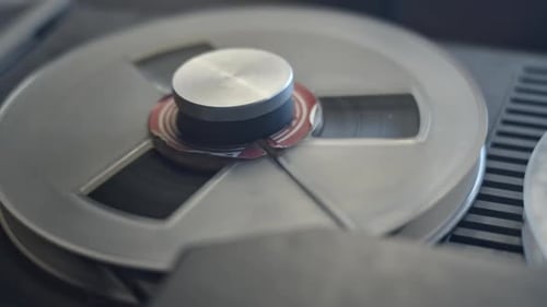 Metal Reel Playing on Vintage Audio Recorder