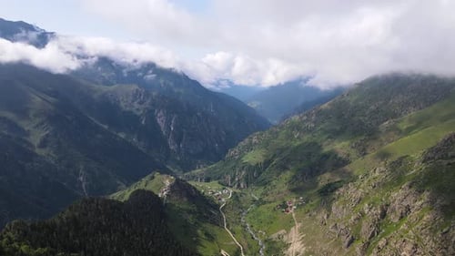 Mountain Village In The Valley Amidst Pine Forests