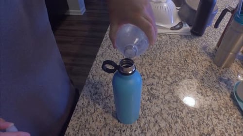 filling a thermos flask with water