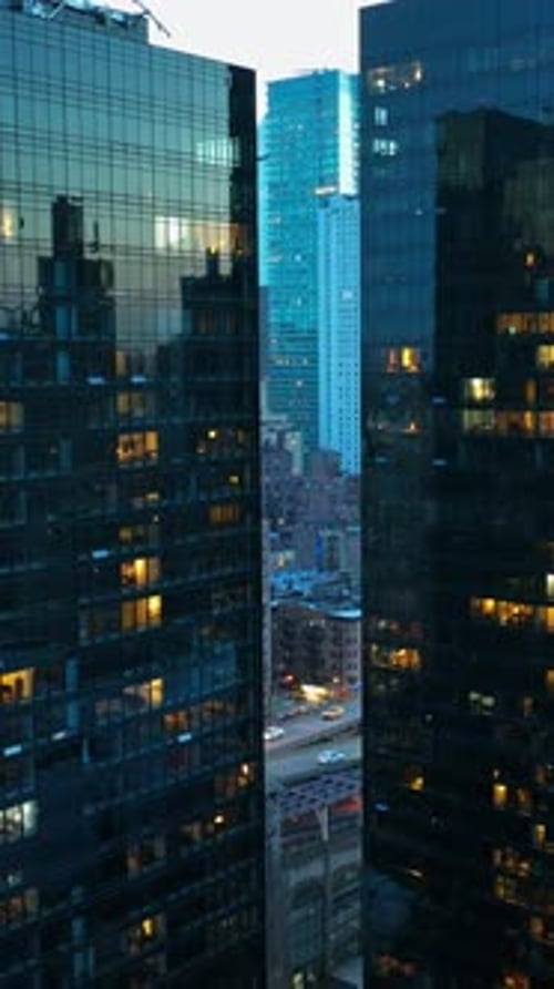 Wonderful modern city architecture. Rising along the buildings with mirror windows reflecting lights