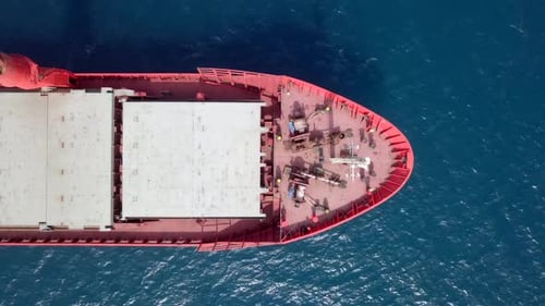 Large Cargo ship anchored away from port, Aerial view