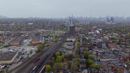 Urban Landscape Showing Toronto Skyline Train Tracks Industrial Buildings and Residential Areas