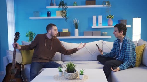 Young Adults Enjoying Music in Bright Living Room