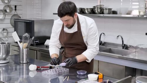 Chef Creating Gourmet Chocolates in Kitchen